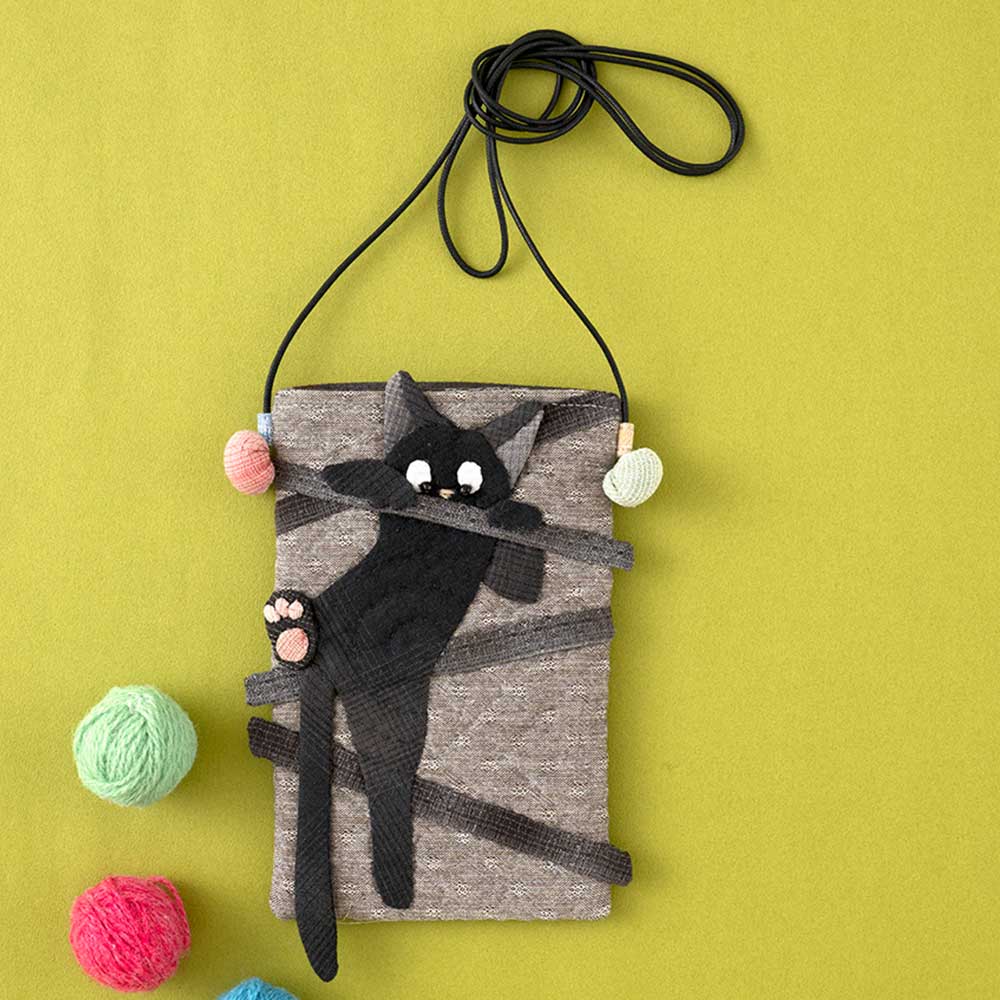 携帯入れポシェット 逃げる猫